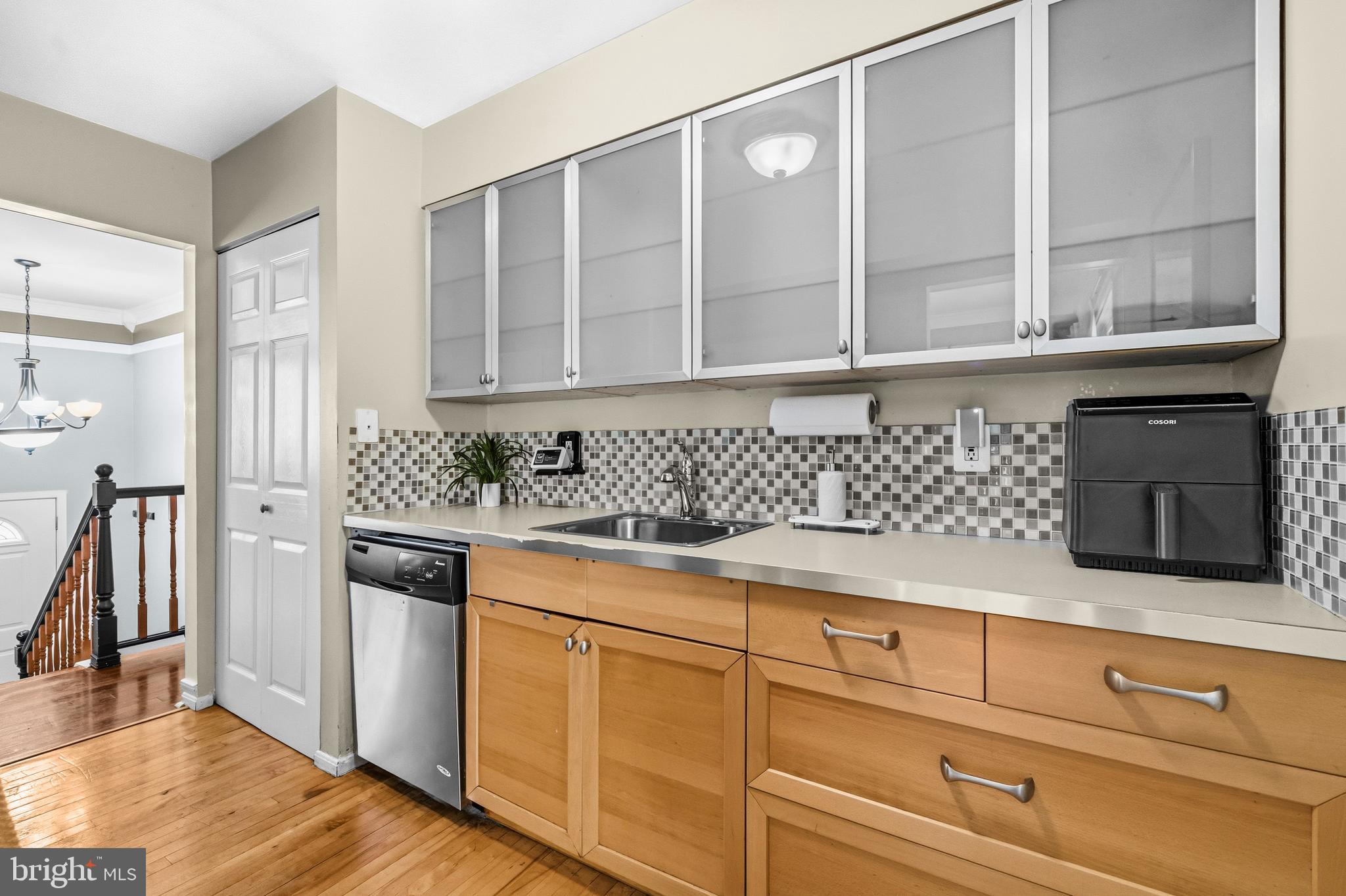 236 Inlet Drive Pasadena, MD 21122 - Photo 12 of 33 a kitchen with stainless steel appliances granite countertop a sink and a granite counter tops