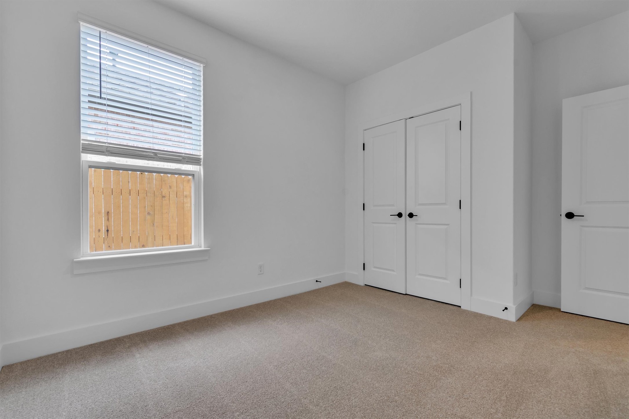 368 Bridge Deck Loop Kyle, TX 78640 - Photo 19 of 40 Unfurnished bedroom featuring carpet, baseboards, and a closet