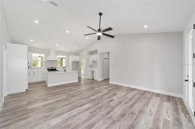 a view of kitchen with wooden floor and a window