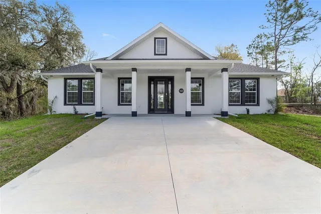 front view of a house with a yard