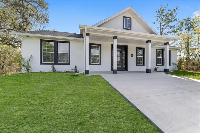 front view of a house with a yard