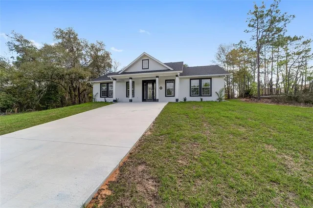 a front view of a house with yard