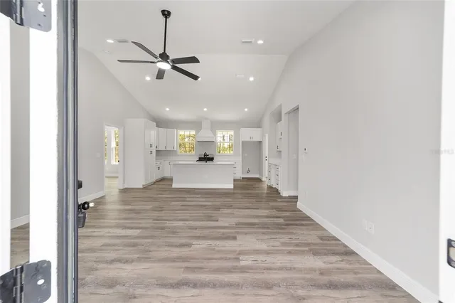 a view of a kitchen with a sink and cabinet area