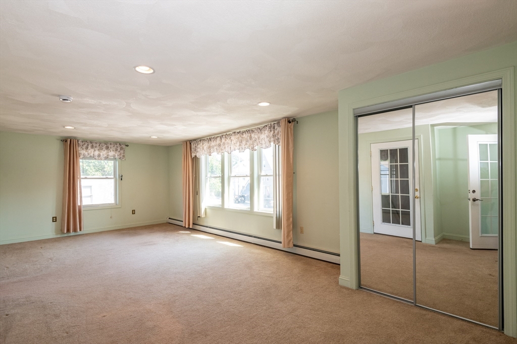 24 Webb Street Salem, MA 01970 - Photo 11 of 38 a view of an empty room with a window