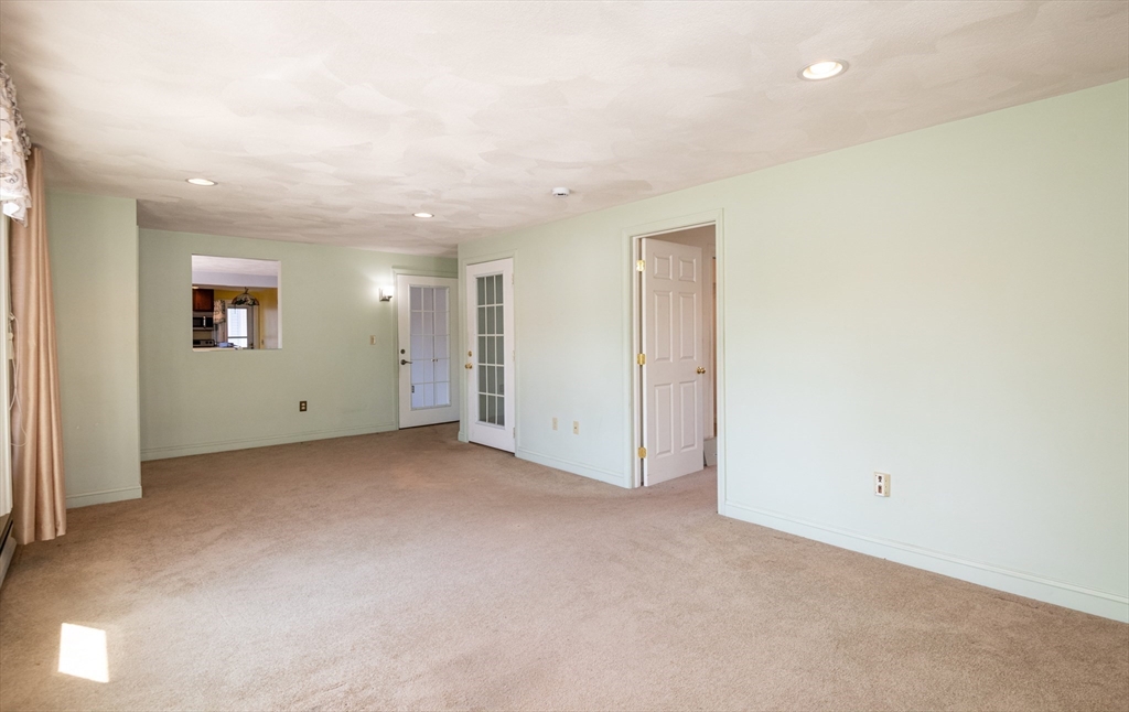 24 Webb Street Salem, MA 01970 - Photo 12 of 38 an empty room with white walls and windows