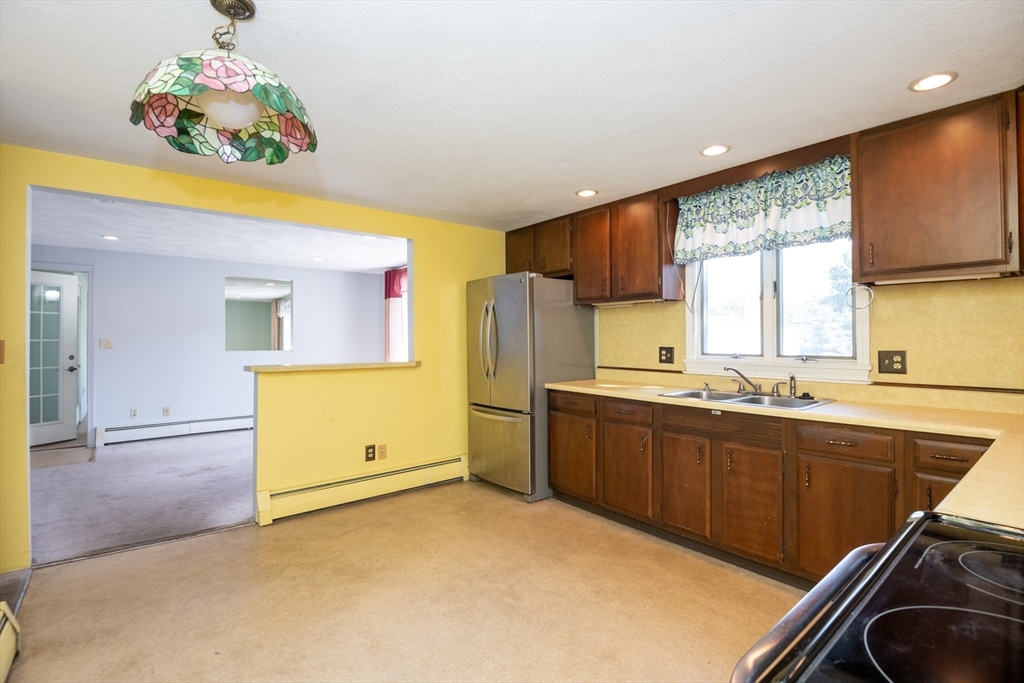 24 Webb Street Salem, MA 01970 - Photo 13 of 38 a kitchen with a sink appliances and cabinets