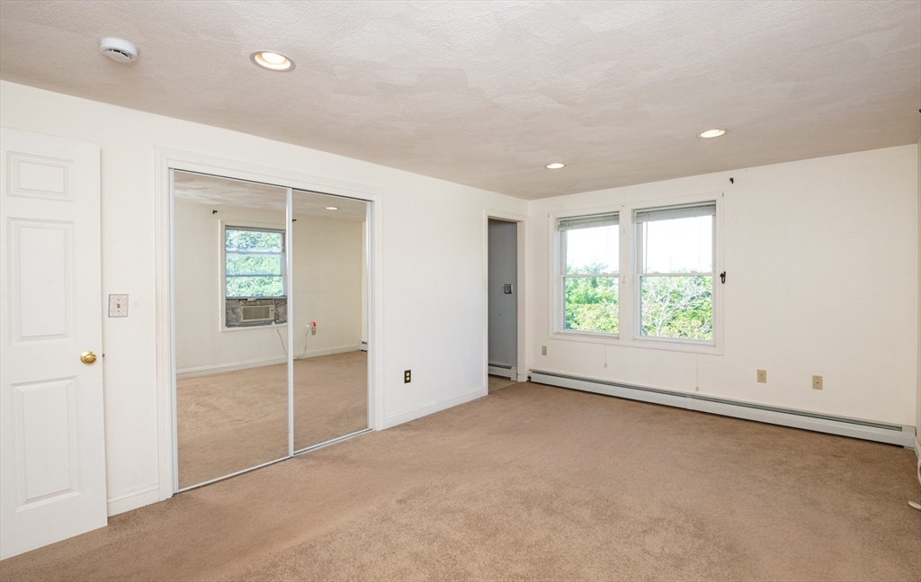 24 Webb Street Salem, MA 01970 - Photo 17 of 38 a view of an empty room with a window