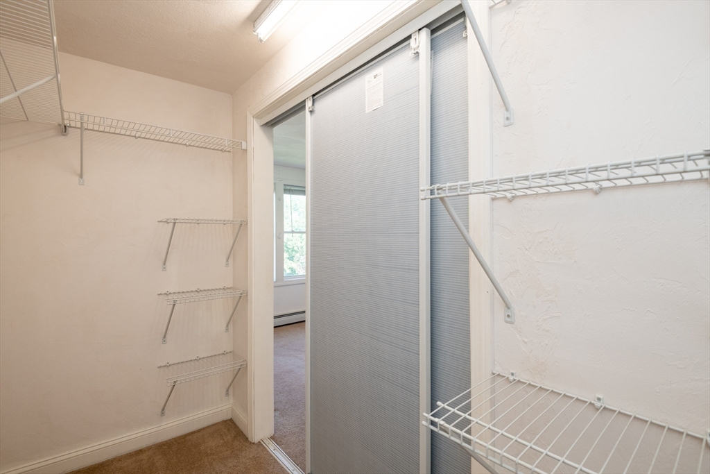 24 Webb Street Salem, MA 01970 - Photo 18 of 38 a bathroom with a glass shower door