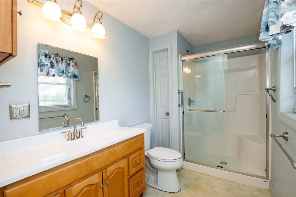 24 Webb Street Salem, MA 01970 - Photo 19 of 38 a bathroom with a sink a toilet and shower