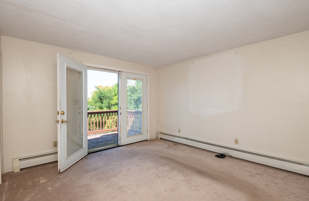 24 Webb Street Salem, MA 01970 - Photo 20 of 38 a view of an empty room with a window