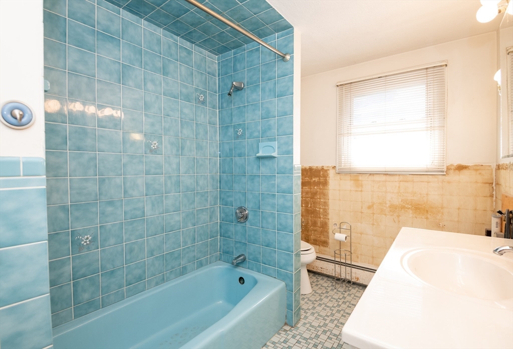 24 Webb Street Salem, MA 01970 - Photo 22 of 38 a bathroom with a bathtub and a shower