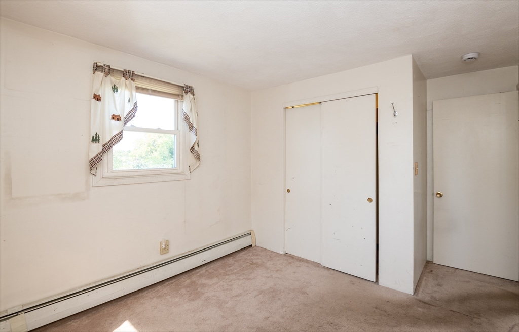 24 Webb Street Salem, MA 01970 - Photo 24 of 38 an empty room with a window
