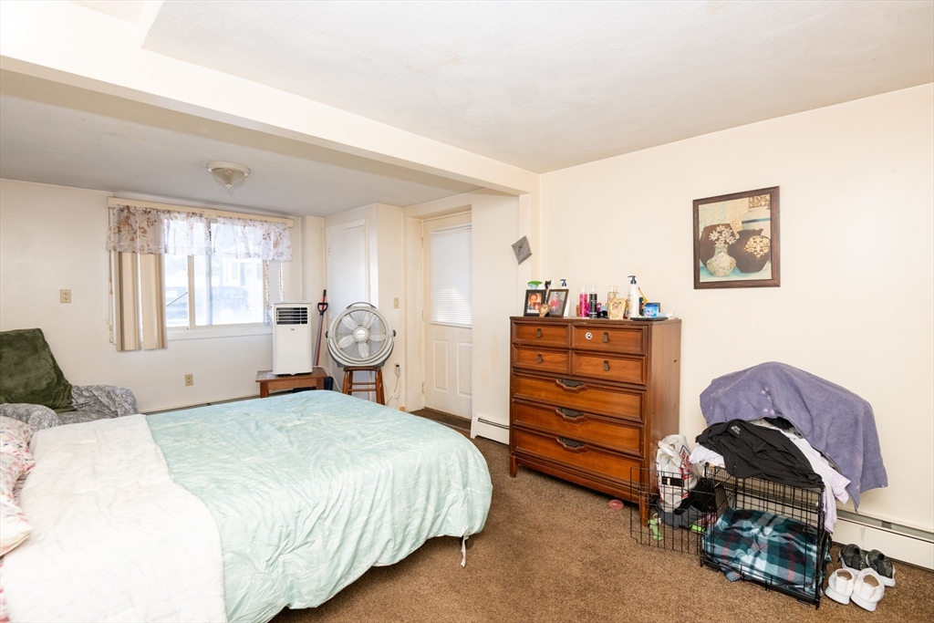 24 Webb Street Salem, MA 01970 - Photo 33 of 38 a bedroom with a bed and a cabinets