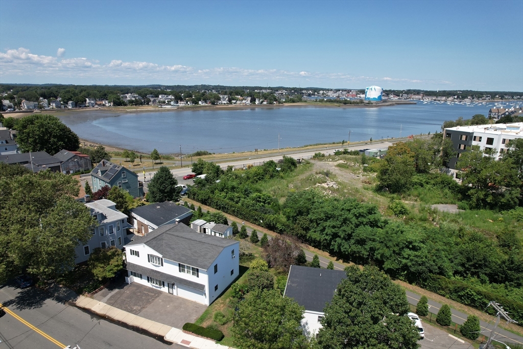 24 Webb Street Salem, MA 01970 - Photo 5 of 38 an aerial view of a house with a lake view