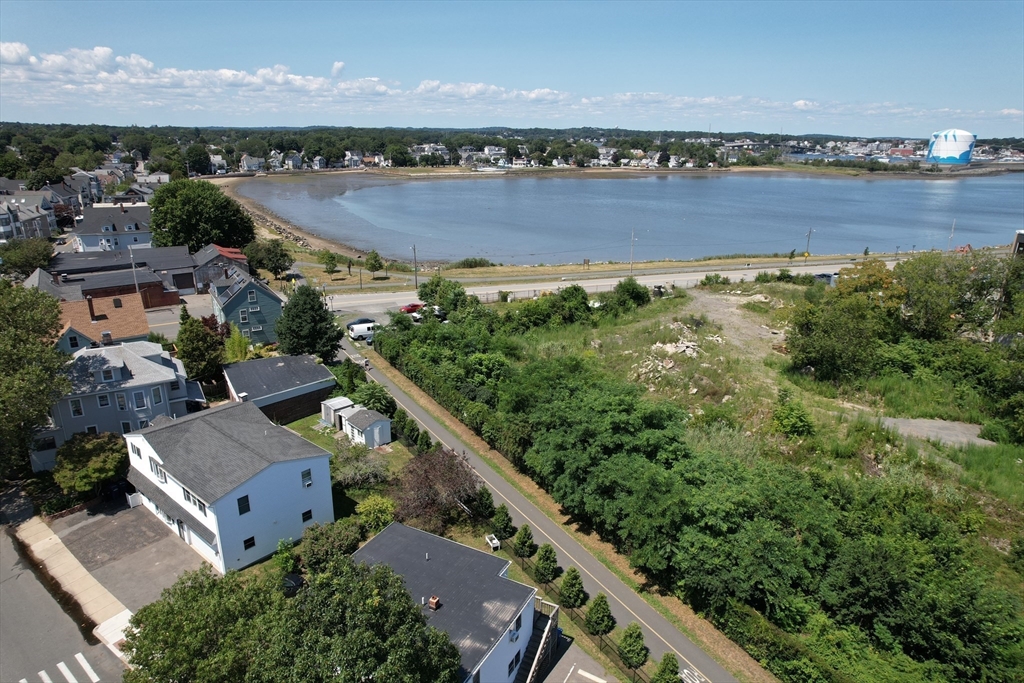 24 Webb Street Salem, MA 01970 - Photo 6 of 38 an aerial view of a house with a garden and lake view