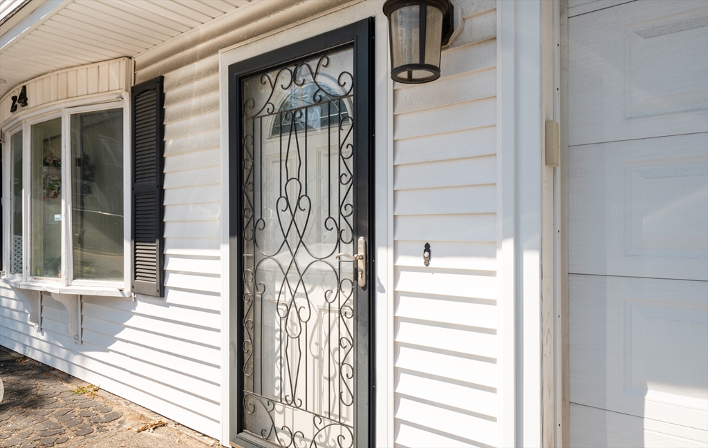 24 Webb Street Salem, MA 01970 - Photo 9 of 38 a view of a door and a window