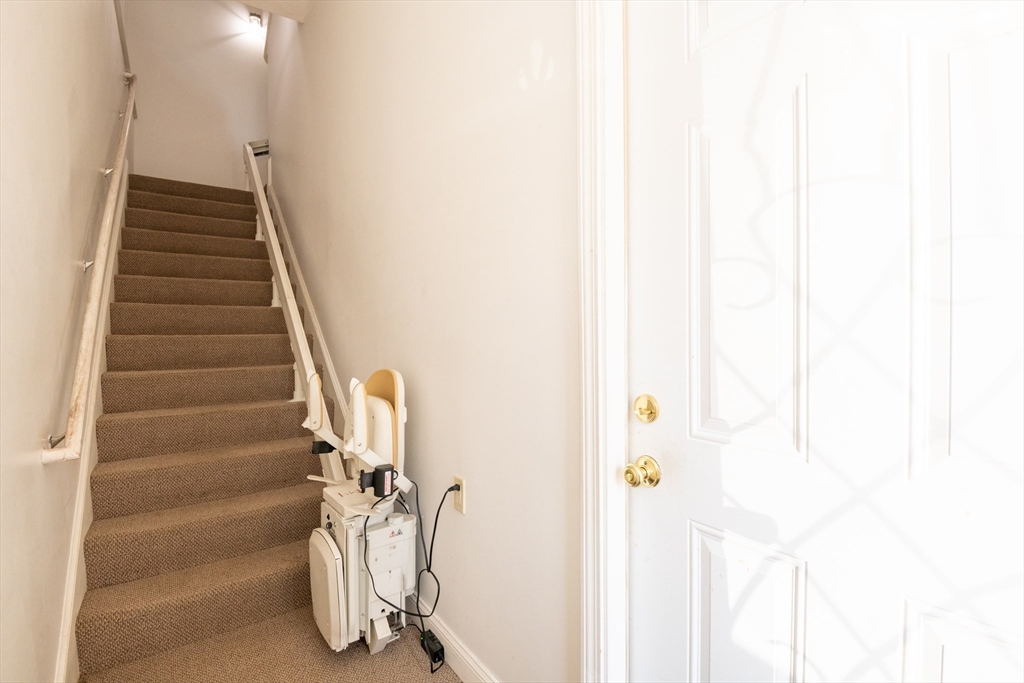 24 Webb Street Salem, MA 01970 - Photo 10 of 38 a view of staircase with white walls