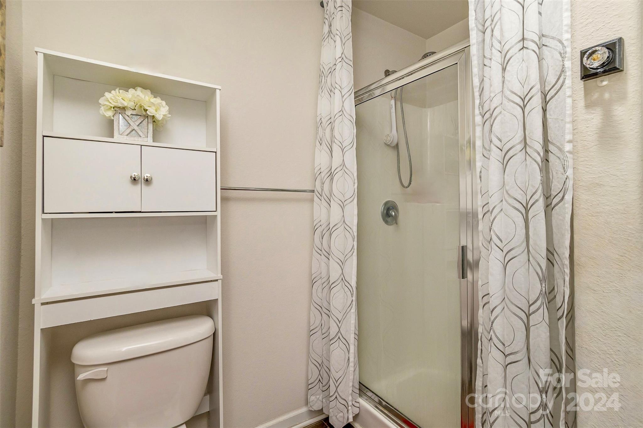 1075 Winding Creek Road Salisbury, NC 28146 - Photo 13 of 18 a bathroom with a shower and a toilet
