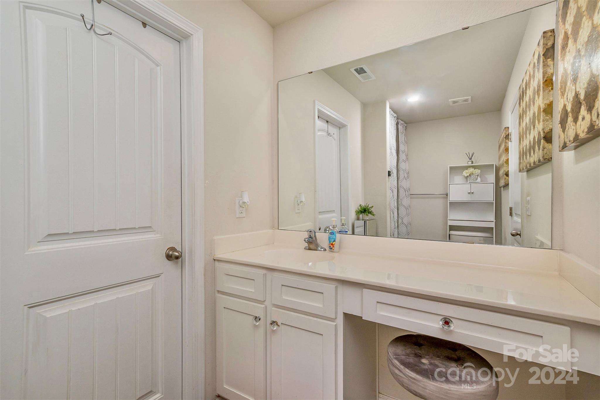 1075 Winding Creek Road Salisbury, NC 28146 - Photo 14 of 18 a bathroom with a sink and a mirror
