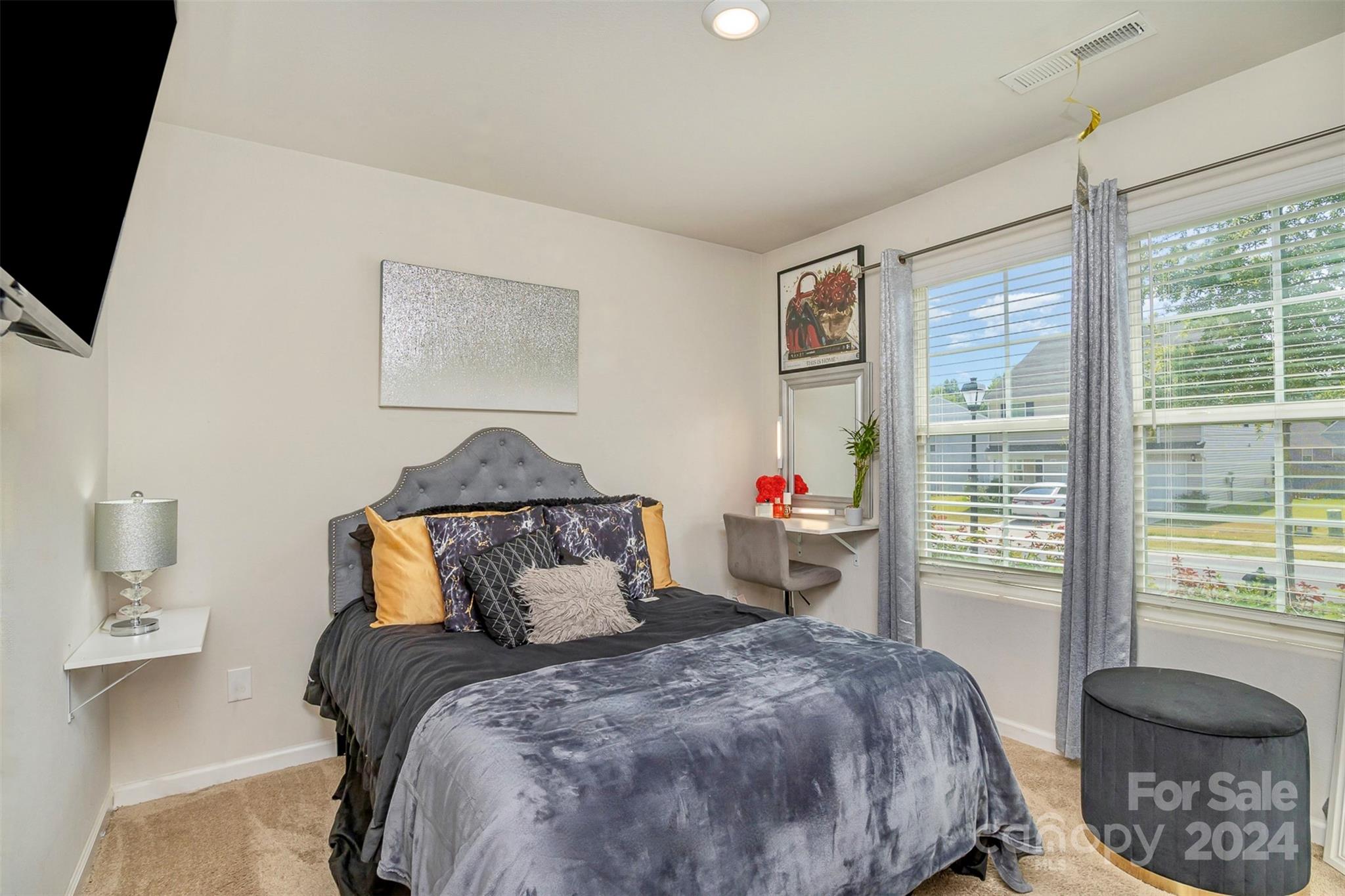 1075 Winding Creek Road Salisbury, NC 28146 - Photo 15 of 18 a bedroom with a bed and glass window