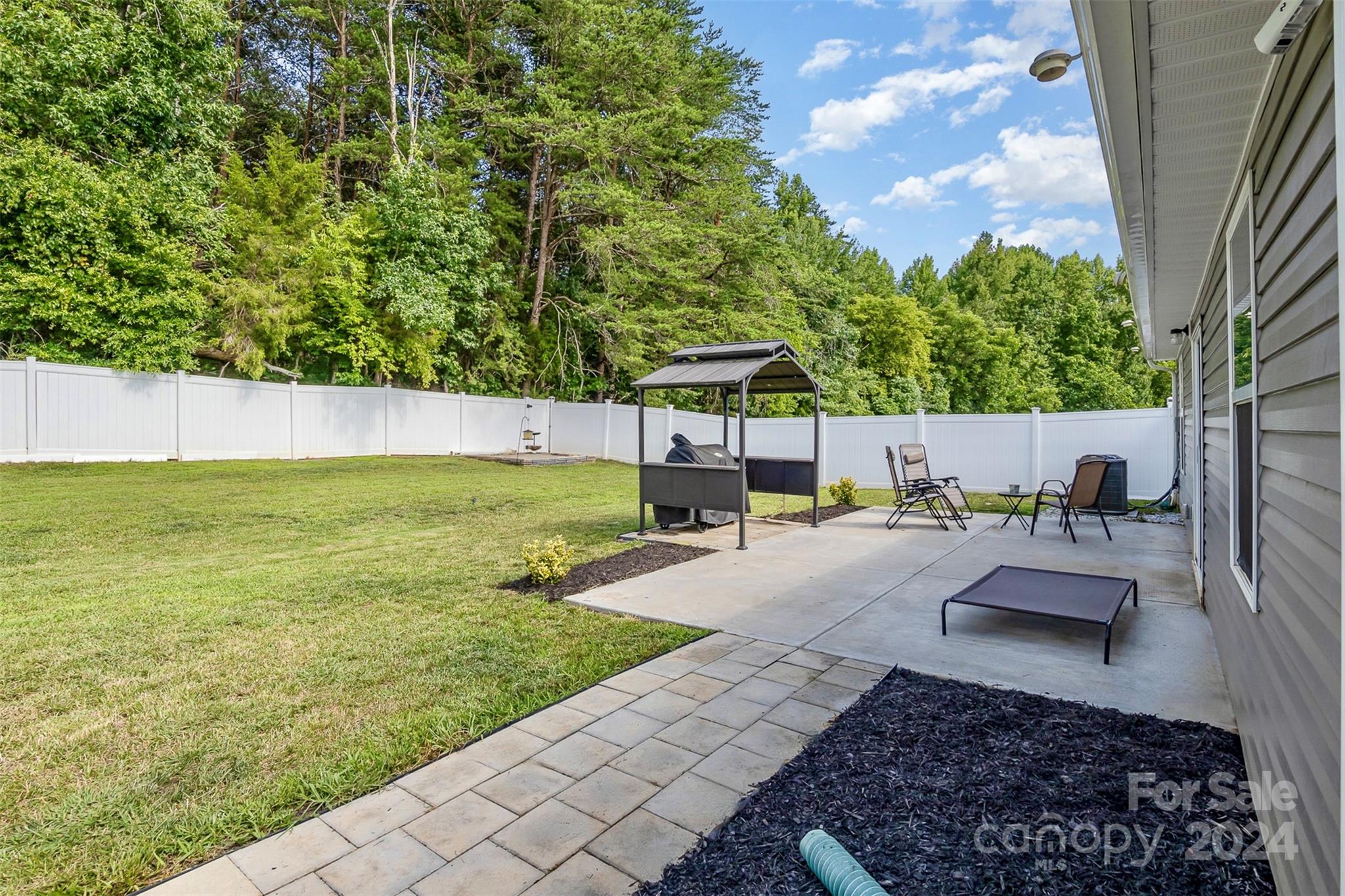 1075 Winding Creek Road Salisbury, NC 28146 - Photo 3 of 18 a view of a backyard with sitting area