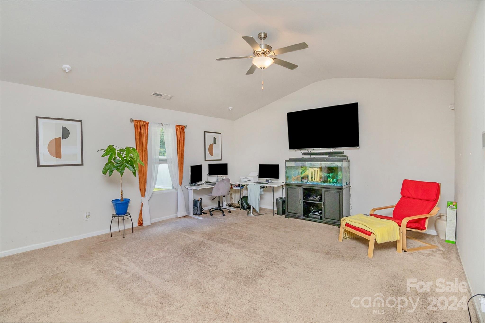 1075 Winding Creek Road Salisbury, NC 28146 - Photo 5 of 18 a living room with furniture a fireplace and a flat screen tv