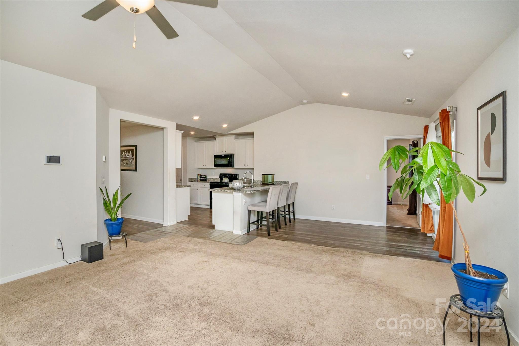 1075 Winding Creek Road Salisbury, NC 28146 - Photo 7 of 18 a view of a livingroom with furniture and a potted plant