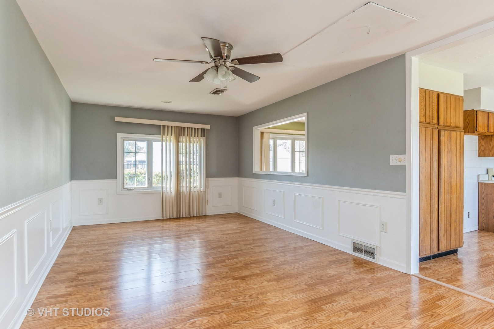 325 Kirman Avenue Romeoville, IL 60446 - Photo 6 of 13 a view of an empty room with a window and wooden floor