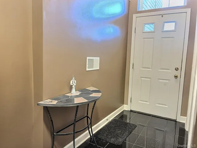 a view of a workspace area with furniture and wooden floor