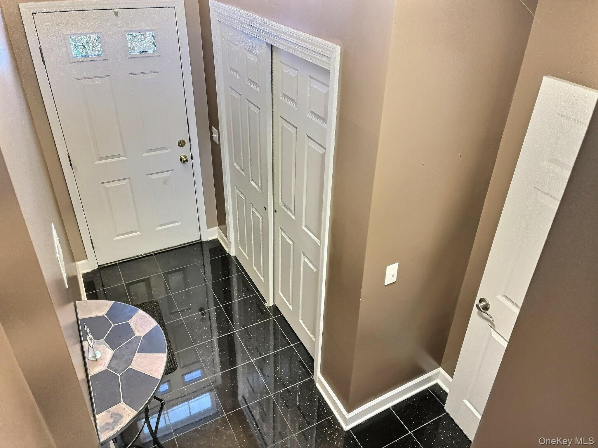 5004 Boulder Way Wappingers Falls, NY 12590 - Photo 3 of 20 a view of an entryway with wooden floor