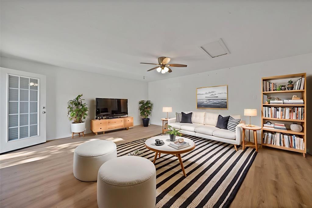 715 East Avenue F Midlothian, TX 76065 - Photo 15 of 33 a living room with furniture wooden floor and a flat screen tv