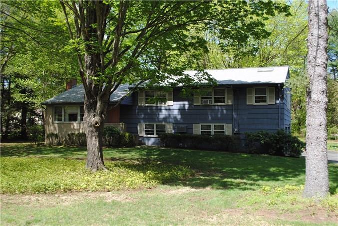 7 Rockyfield Road Westport, CT 06880 - Photo 1 of 1 a front view of a house with garden