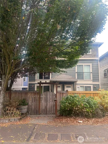 front view of a house with a bench