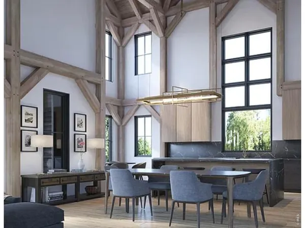 a view of a dining room with furniture and a large window