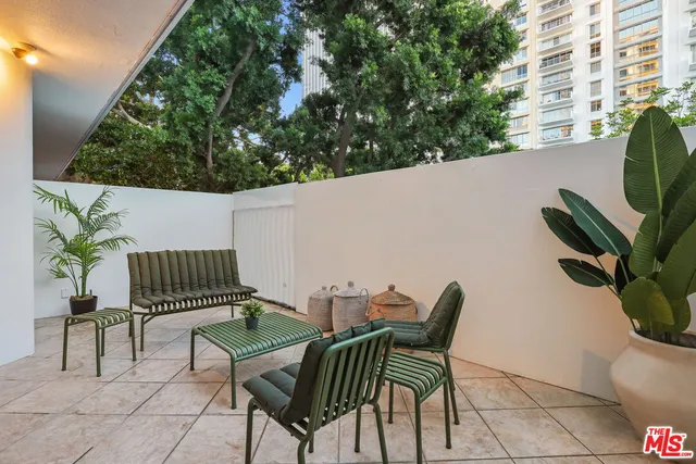 a view of balcony with furniture