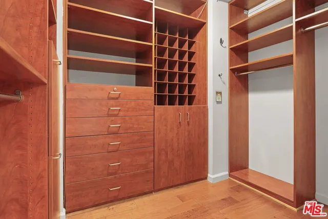 a bathroom with a granite countertop sink mirror bathtub and toilet