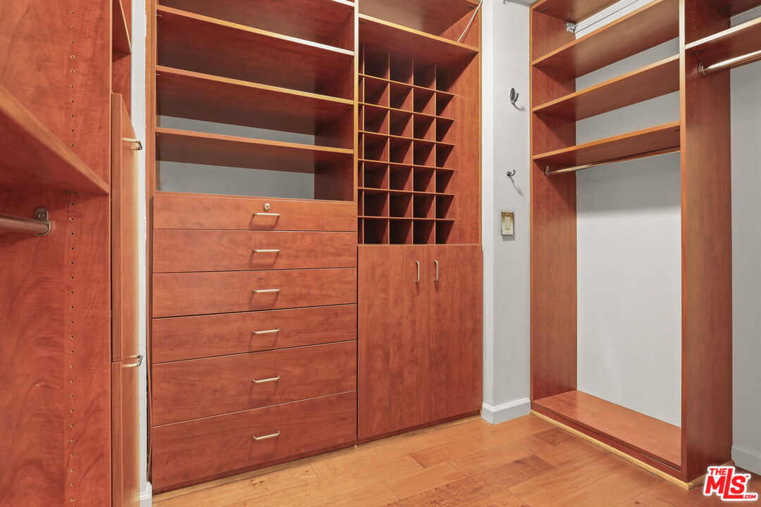 2170 Century Park East, Unit 104 Los Angeles, CA 90067 - Photo 17 of 42 a view of walk in closet with empty racks