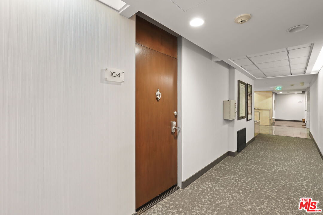 2170 Century Park East, Unit 104 Los Angeles, CA 90067 - Photo 20 of 42 a view of a hallway with wooden shelves