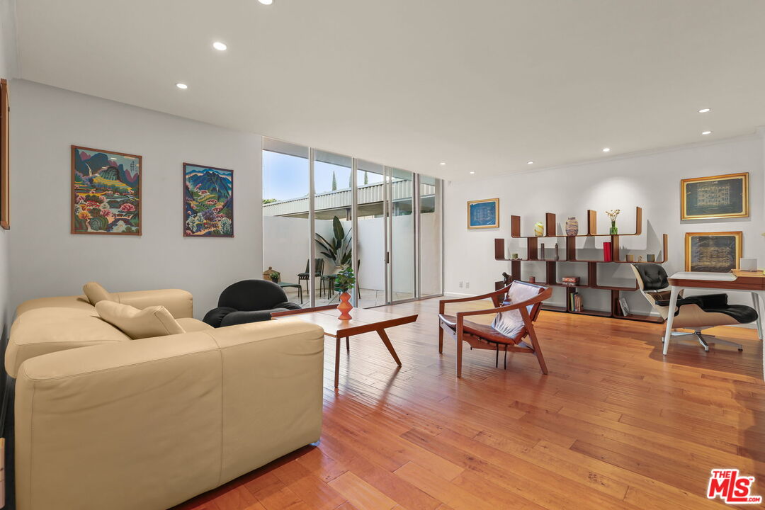 2170 Century Park East, Unit 104 Los Angeles, CA 90067 - Photo 2 of 42 a living room with furniture and wooden floor