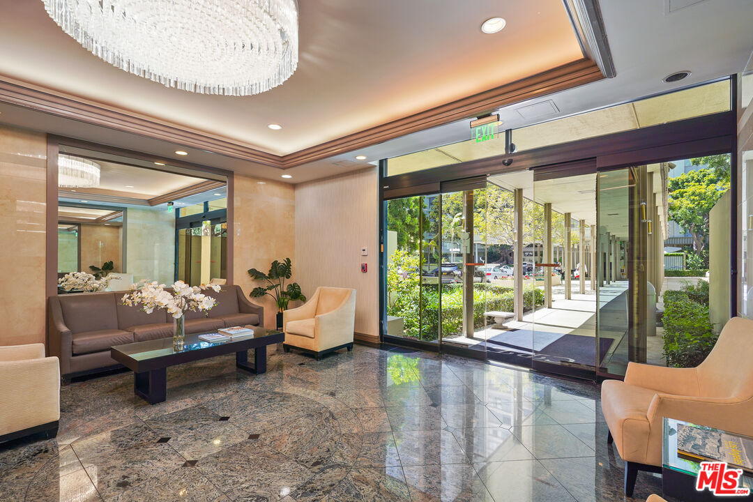 2170 Century Park East, Unit 104 Los Angeles, CA 90067 - Photo 24 of 42 a living room with furniture and a large window