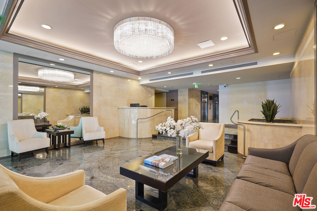 2170 Century Park East, Unit 104 Los Angeles, CA 90067 - Photo 26 of 42 a living room with furniture and a chandelier