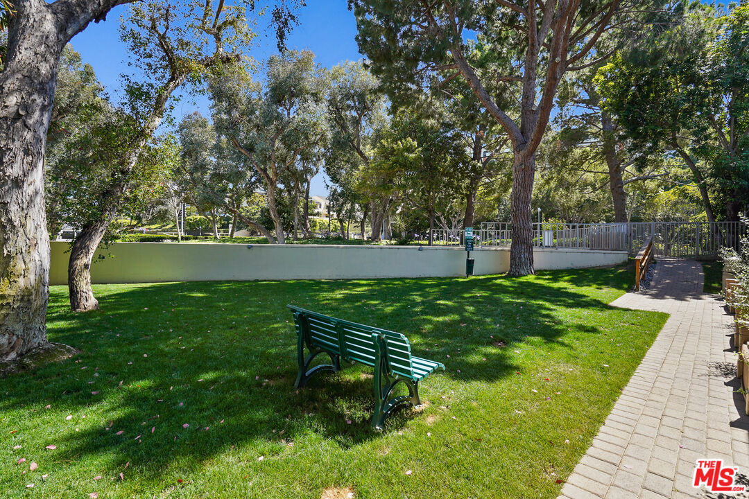 2170 Century Park East, Unit 104 Los Angeles, CA 90067 - Photo 33 of 42 a view of yard with swimming pool and green space