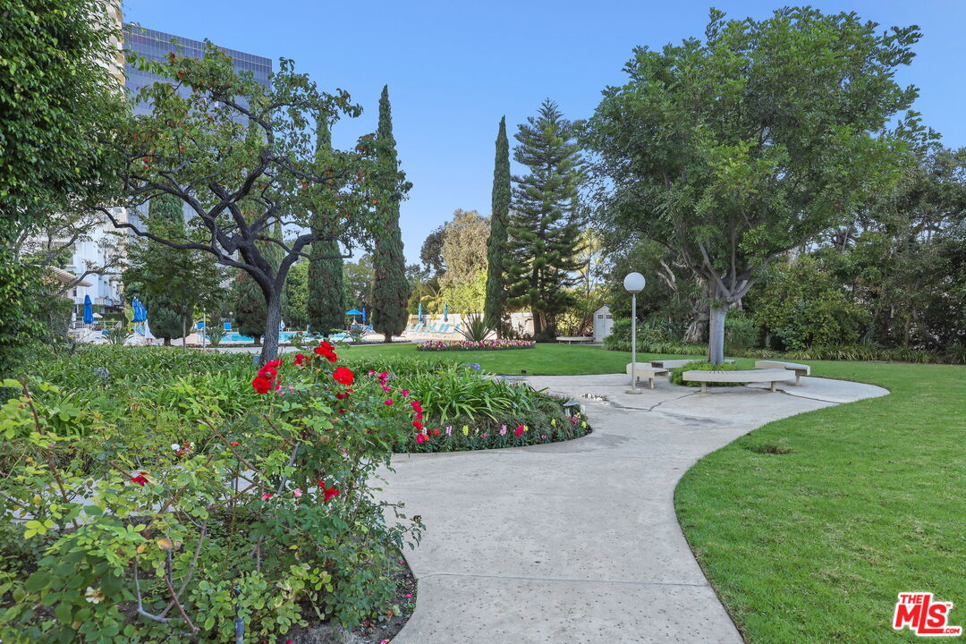 2170 Century Park East, Unit 104 Los Angeles, CA 90067 - Photo 36 of 42 a view of a garden with flowers and trees
