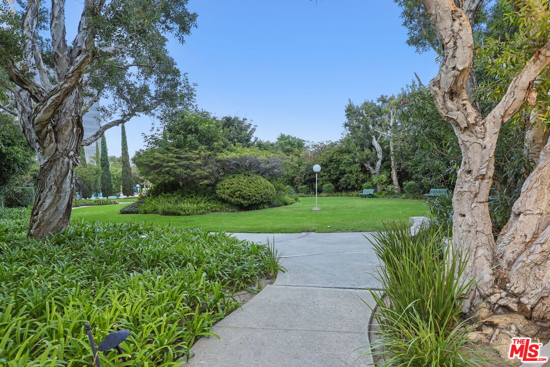 2170 Century Park East, Unit 104 Los Angeles, CA 90067 - Photo 37 of 42 a view of a garden with a fountain