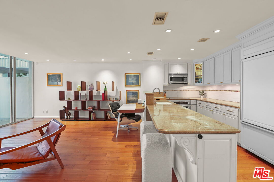 2170 Century Park East, Unit 104 Los Angeles, CA 90067 - Photo 9 of 42 a view of kitchen with dining table and chairs