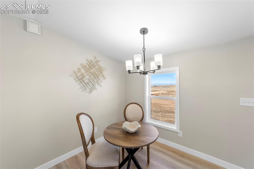 35275 Book Road Yoder, CO 80864 - Photo 11 of 30 a view of a hallway with a chandelier