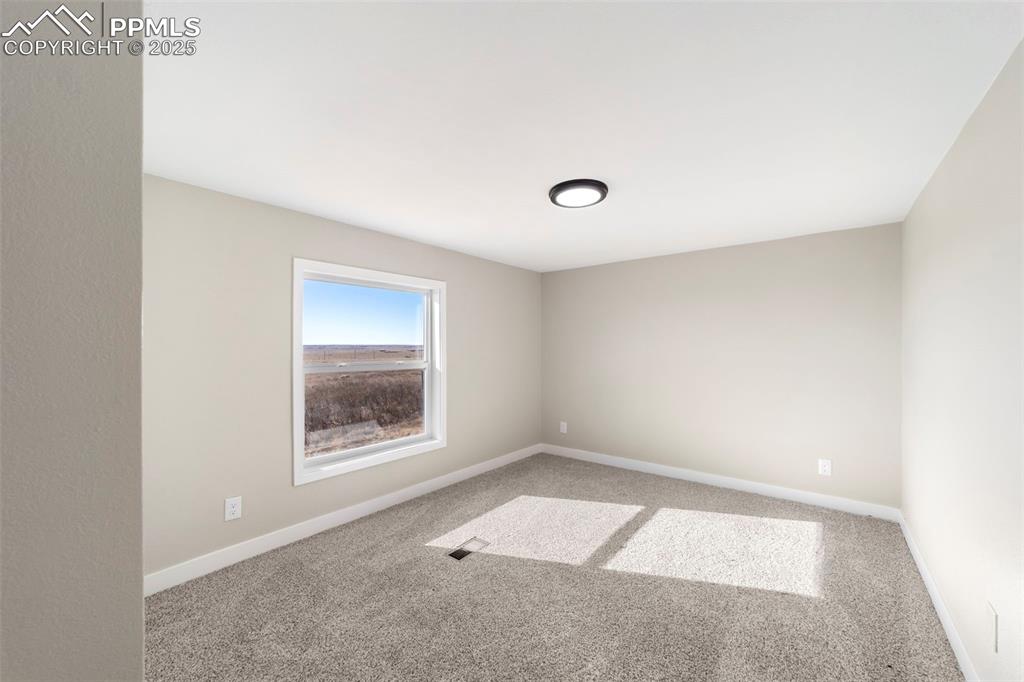 35275 Book Road Yoder, CO 80864 - Photo 14 of 30 an empty room with a window