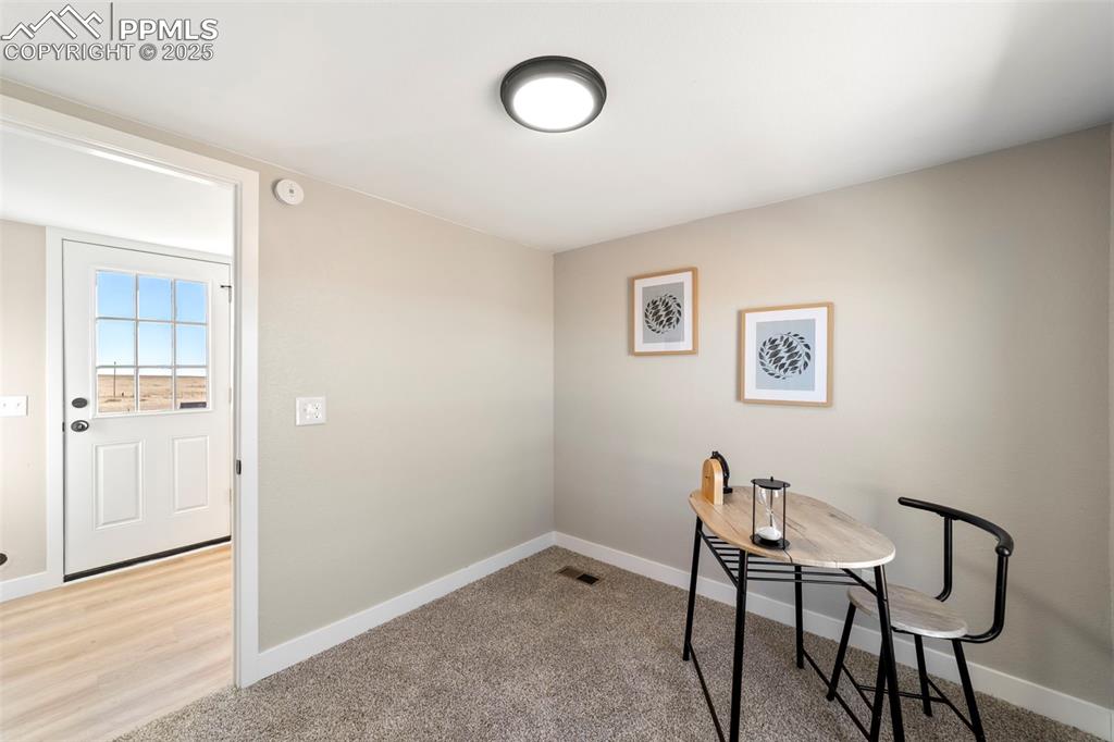 35275 Book Road Yoder, CO 80864 - Photo 19 of 30 a view of a room with furniture and wooden floor