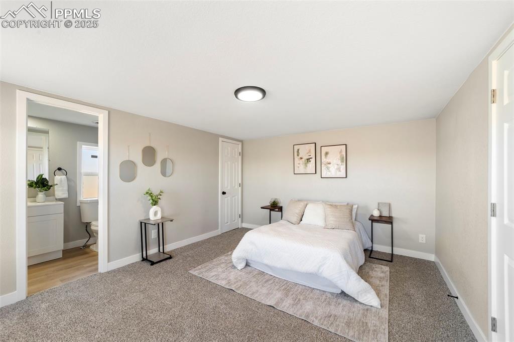 35275 Book Road Yoder, CO 80864 - Photo 20 of 30 a bedroom with a bed and a table