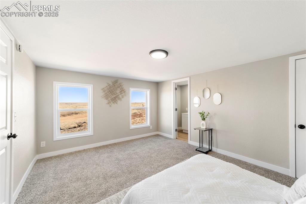 35275 Book Road Yoder, CO 80864 - Photo 22 of 30 an empty room with windows and closet